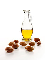 Picture of Argan Nuts and Argan Oil in a Glass Jar